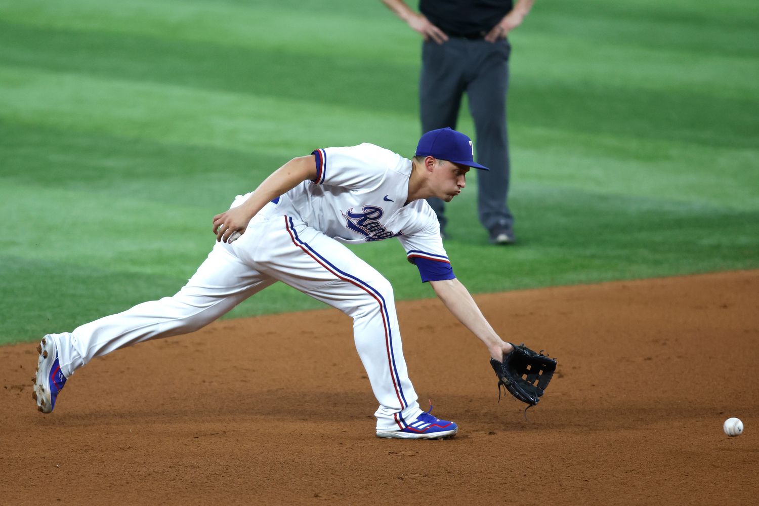 Aug 14, 2023; Arlington, Texas, USA; Texas Rangers shortstop Corey Seager (5) fields a ground ball in the fourth inning against the Los Angeles Angels at Globe Life Field. Mandatory Credit: Tim Heitman-USA TODAY Sports  